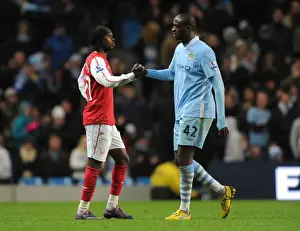 Manchester City V Arsenal 2011-12 Prints: Gervinho and Yaya Toure: A Moment of Sportsmanship Amidst Manchester City vs
