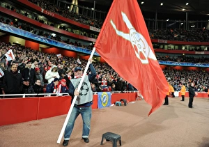 Giant flags are waved pitchside during half time. Arsenal 2: 1 Barcelona
