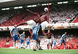 Images Dated 11th May 2006: Gilberto and Kolo Toure (Arsenal) jump for the ball with Pascal Chimbonda (Wigan)