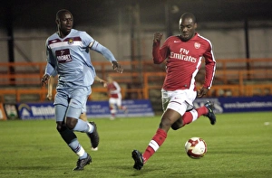 Images Dated 9th March 2009: Gilles Sunu (Arsenal) Bondz N Gala (West Ham)