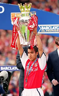 Giovanni van Bronckhorst with the F. A. Barclaycard Premiership Trophy