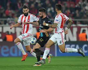 Olympiacos V Arsenal 2015-16 Prints: Giroud Goes Head-to-Head with Siovas and da Costa in Olympiacos vs Arsenal UEFA Champions League Clash