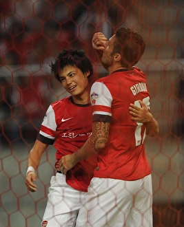 Nagoya Grampus V Arsenal 2013-14 Prints: Giroud and Miyaichi Celebrate Goal: Nagoya Grampus vs. Arsenal, 2013