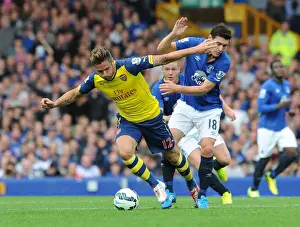 Everton V Arsenal 2014/15 Prints: Giroud vs. Barry: A Football Rivalry Unfolds at Goodison Park - Everton vs
