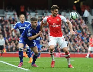 Arsenal v Chelsea 2014/15 Collection: Giroud vs. Cahill: A Footballing Battle at the Emirates - Arsenal vs