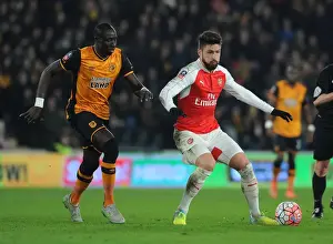 15/16 Hull City V Arsenal FA Cup Prints: Giroud vs Diame: FA Cup Showdown - Arsenal's Star Forward Clashes with Hull Midfielder