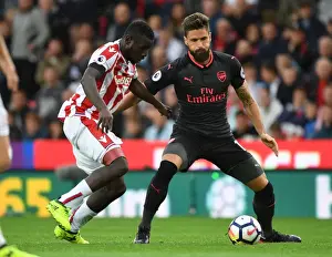 Stoke City V Arsenal 2017-18 Prints: Giroud vs Diouf: Intense Battle at Stoke City vs Arsenal, Premier League 2017-18