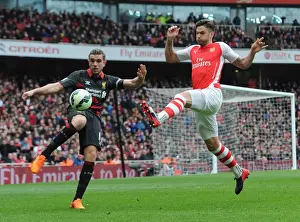Arsenal V Liverpool 2014-15 Prints: Giroud vs. Henderson: A Premier League Battle at Emirates Stadium