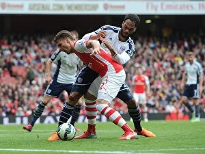 Arsenal v West Bromwich Albion 2014/15 Collection: Giroud vs Lescott: Intense Battle at Emirates Stadium during Arsenal vs West Brom Clash