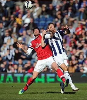 Images Dated 6th April 2013: Giroud vs McAuley: A Footballing Battle at The Hawthorns - Arsenal vs West Bromwich Albion (2013)