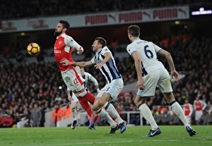 Images Dated 26th December 2016: Giroud vs McAuley: Intense Battle at Emirates Stadium - Arsenal v West Bromwich Albion
