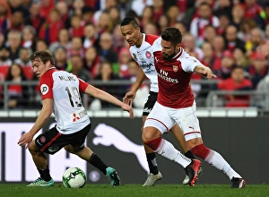Sydney Western Wanderers V Arsenal 2017-18 Prints: Giroud vs. Melling: A Football Battle - Arsenal's Olivier Giroud Clashes with Sydney Wanderers Jacob Melling