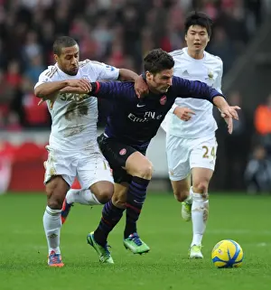 Swansea V Arsenal - FA Cup 3rd Rd 2012-13 Prints: Giroud vs Routledge: A FA Cup Battle at Swansea's Liberty Stadium