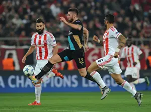 Olympiacos V Arsenal 2015-16 Prints: Giroud vs Siovas and da Costa: A Fierce Face-Off in Olympiacos vs Arsenal UEFA Champions League Match