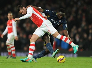Arsenal V Southampton 2014-15 Prints: Giroud vs. Wanyama: A Battle of Strength in the Arsenal vs