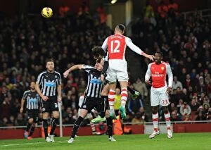 Images Dated 13th December 2014: Giroud's Last-Minute Strike: Arsenal Edge Newcastle in Premier League Thriller