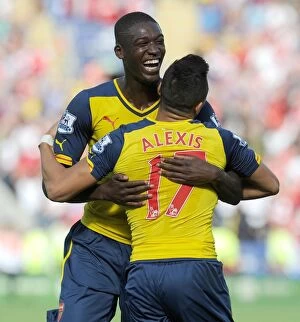 Images Dated 31st August 2014: Glory Days: Sanchez and Sanogo's Unforgettable Goal Celebration vs. Leicester City (2014-15)