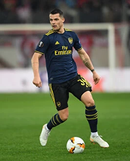 Images Dated 20th February 2020: Granit Xhaka in Action: Arsenal vs. Olympiacos, UEFA Europa League Round of 32 (Piraeus, 2020)