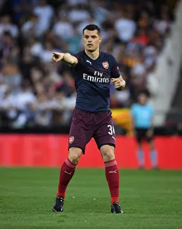 Valencia CF V Arsenal 2018-19 Prints: Granit Xhaka in Action: Arsenal vs Valencia, UEFA Europa League Semi-Final (2018-19)