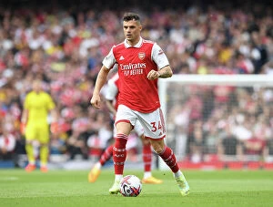Images Dated 14th May 2023: Granit Xhaka in Action: Arsenal's Midfield Maestro Shines Against Brighton & Hove Albion