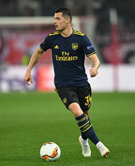 Images Dated 20th February 2020: Granit Xhaka in Action: Olympiacos vs. Arsenal, UEFA Europa League Round of 32 (Piraeus, 2020)