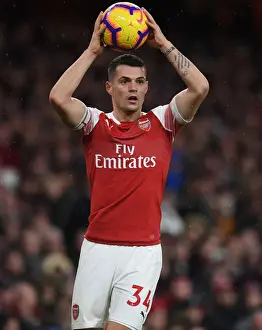 Arsenal V Huddersfield Town - 2018-19 Prints: Granit Xhaka: Arsenal's Midfield Maestro in Action Against Huddersfield Town