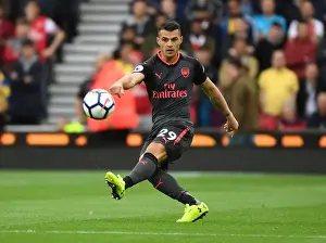 Stoke City V Arsenal 2017-18 Prints: Granit Xhaka: Arsenal's Midfield Maestro in Action against Stoke City
