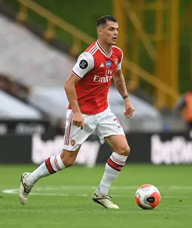 Wolverhampton Wanderers V Arsenal 2019-20 Prints: Granit Xhaka: Arsenal's Midfield Maestro in Action vs. Wolverhampton Wanderers