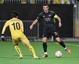 Bodø/Glimt V Arsenal 2022-23 Prints: Granit Xhaka: Arsenal's Midfield Maestro Dazzles in Europa League Clash vs