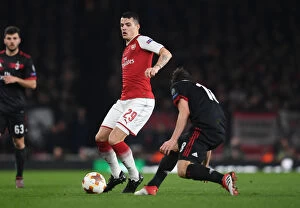 Images Dated 15th March 2018: Granit Xhaka: Arsenal's Midfield Maestro in Europa League Clash Against AC Milan