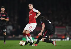 Arsenal V AC Milan 2017-18 Prints: Granit Xhaka: Arsenal's Midfield Maestro in Europa League Clash Against AC Milan