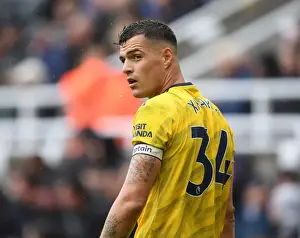 Newcastle United V Arsenal 2019-20 Prints: Granit Xhaka: Arsenal's Midfield Maestro Shines in Premier League Battle against Newcastle United