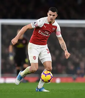 Arsenal V Huddersfield Town - 2018-19 Prints: Granit Xhaka: Arsenal's Midfield Mastermind in Action against Huddersfield Town