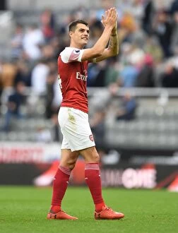 Images Dated 15th September 2018: Granit Xhaka Celebrates with Arsenal Fans after Newcastle United Victory