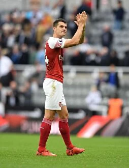 Images Dated 15th September 2018: Granit Xhaka Celebrates with Arsenal Fans after Newcastle United Victory