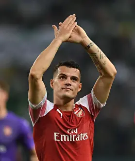 Sporting Lisbon V Arsenal 2018-19 Prints: Granit Xhaka Celebrates with Arsenal Fans after UEFA Europa League Win over Sporting Lisbon