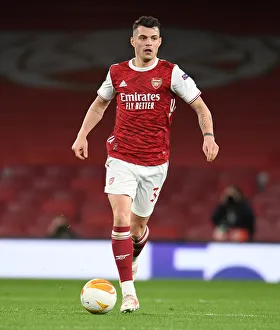 Granit Xhaka at Empty Emirates: Arsenal's Quarterfinal Battle against Slavia Praha in UEFA Europa League Amidst Pandemic Restrictions
