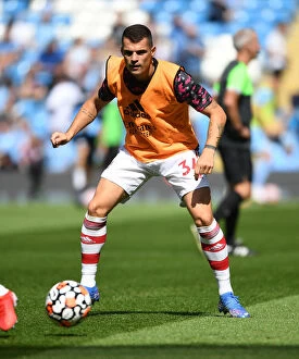 Manchester City v Arsenal 2021-22 Collection: Granit Xhaka Gears Up: Manchester City vs Arsenal, Premier League 2021-22