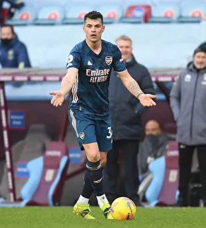 Aston Villa V Arsenal 2020-21 Prints: Granit Xhaka: Empty Villa Park Showdown - Arsenal vs. Aston Villa, Premier League 2021