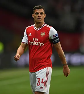 Eintracht Frankfurt V Arsenal 2019-20 Prints: Granit Xhaka's Brilliant Midfield Performance: Arsenal Triumphs Over Eintracht Frankfurt in Europa League