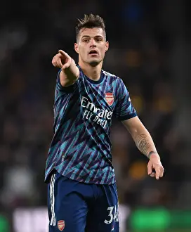 Wolverhampton Wanderers V Arsenal 2021-22 Prints: Granit Xhaka's Brilliant Midfield Performance: Arsenal Triumphs Over Wolverhampton Wanderers