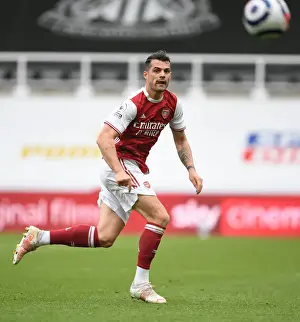 Newcastle United V Arsenal 2020-21 Prints: Granit Xhaka's Brilliant Performance: Arsenal's Midfield Masterclass at Empty St