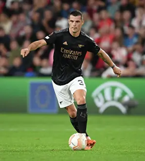 PSV Eindhoven V Arsenal 2022-23 Prints: Granit Xhaka's Commanding Midfield Display: Arsenal's Europa League Victory over PSV Eindhoven
