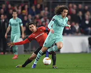 Stade Rennes V Arsenal 2018-19 Prints: Guendouzi vs. Andre: A Fiery Europa League Clash between Arsenal and Rennes