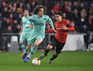 Stade Rennes V Arsenal 2018-19 Prints: Guendouzi vs. Andre: A Fiery Europa League Showdown at Stade Rennais (Arsenal vs)