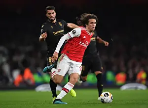 Arsenal V Vitoria Club 2019-20 Prints: Guendouzi vs Pepe: Europa League Showdown at Arsenal's Emirates Stadium