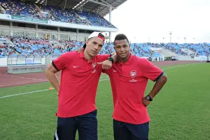 Vietnam V Arsenal 2013-14 Prints: HANOI, VIETNAM - JULY 17: Lukas Podolski and Serge Gnabry of Arsenal before the international