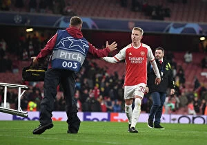 Arsenal v Sevilla 2023-24 Collection: A Heartfelt Moment: Oleksandr Zinchenko's Unexpected Friendship with an Arsenal Groundsman
