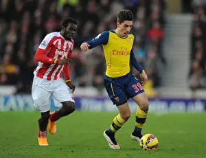 Stoke City V Arsenal 2014-15 Prints: Hector Bellerin Outmaneuvers Mame Diouf: A Moment from Stoke City vs. Arsenal (2014-15)