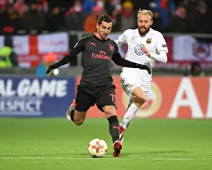 Ostersunds V Arsenal 2017-18 Prints: Henrikh Mkhitaryan vs Curtis Edwards: Battle in the Europa League between Ostersunds and Arsenal